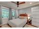 Cozy bedroom featuring a queen bed, natural light, ceiling fan and neutral colors at 128 Paul Dr, Summerville, SC 29483