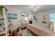 Bedroom featuring a queen bed, wood floors, a white desk and plenty of wall decorations at 128 Paul Dr, Summerville, SC 29483