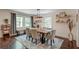 Bright dining room with a wooden table, stylish chairs, a decorative rug, and natural light at 128 Paul Dr, Summerville, SC 29483