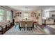 Bright dining room featuring wood table, six chairs, overhead lighting, and open shelving at 128 Paul Dr, Summerville, SC 29483
