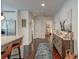 Hallway with hardwood floors, white walls, and a view into the kitchen at 128 Paul Dr, Summerville, SC 29483