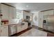 Bright kitchen featuring stainless steel appliances, white cabinets, and a view into the dining area at 128 Paul Dr, Summerville, SC 29483
