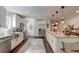 Modern kitchen featuring stainless steel appliances, white cabinets, and an island with pendant lights at 128 Paul Dr, Summerville, SC 29483