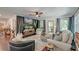 Comfortable living room featuring modern furnishings, a ceiling fan, and a stylish area rug at 128 Paul Dr, Summerville, SC 29483