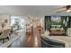 Open-concept living space connects to a kitchen with hardwood floors at 128 Paul Dr, Summerville, SC 29483
