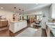 Open concept living space with kitchen, dining, and Gathering room, hardwood floors and natural light at 128 Paul Dr, Summerville, SC 29483