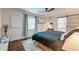 Comfortable main bedroom with a ceiling fan, ensuite bath, and closet space at 128 Paul Dr, Summerville, SC 29483