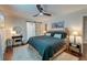 Comfortable main bedroom with a ceiling fan, ensuite bath, and barn-style door at 128 Paul Dr, Summerville, SC 29483