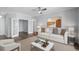 Cozy living room featuring a comfortable couch, stylish art, and a view into another room at 130 River Landing Dr # 4102, Charleston, SC 29492