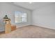 An empty bedroom with neutral carpet flooring, a window, and boxes for moving at 134 Percheron Dr, Summerville, SC 29486