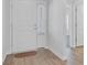 The home's entrance features a white door and light wood flooring with a view into other rooms at 134 Percheron Dr, Summerville, SC 29486