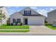 Charming two-story home with a well-maintained lawn, a garage, and a classic architectural style at 134 Percheron Dr, Summerville, SC 29486
