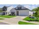 Charming two-story home with a well-maintained lawn, a garage, and a classic architectural style at 134 Percheron Dr, Summerville, SC 29486