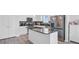 Modern kitchen with stainless steel appliances, granite countertops, and a spacious center island at 134 Percheron Dr, Summerville, SC 29486