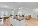 Bright open-concept living room showcases neutral walls, wood floors, and access to a modern kitchen at 134 Percheron Dr, Summerville, SC 29486