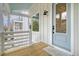 Inviting front porch with white railings, a light blue door, and views of the neighborhood at 1340 Lucinda St, Mount Pleasant, SC 29466