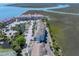 Expansive aerial view of waterfront condos showcasing a pool, tennis court, and convenient parking at 142 Marsh View Villas, Folly Beach, SC 29439