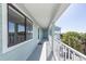 This balcony features white railings and beautiful view of nearby vegetation at 142 Marsh View Villas, Folly Beach, SC 29439
