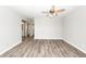 Bedroom with wood look flooring, large closet and ceiling fan at 142 Marsh View Villas, Folly Beach, SC 29439