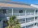 Condo exterior featuring private balconies and coastal design, perfect for seaside living at 142 Marsh View Villas, Folly Beach, SC 29439