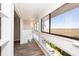 Bright hallway with multiple windows offering scenic outside views at 142 Marsh View Villas, Folly Beach, SC 29439
