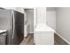 A laundry closet featuring a stacked washer/dryer, and white quartz countertops at 142 Marsh View Villas, Folly Beach, SC 29439