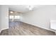 Bright living room featuring wood floors and ample natural light at 142 Marsh View Villas, Folly Beach, SC 29439