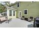 Inviting back deck featuring wicker furniture, offering a relaxing outdoor space for entertaining and enjoying the serene surroundings at 149 Daniels Ridge Dr, Summerville, SC 29485