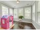 Versatile bonus room filled with natural light and featuring dark hardwood floors at 149 Daniels Ridge Dr, Summerville, SC 29485