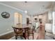 Bright breakfast nook with dark wood floors and a view of the modern kitchen at 149 Daniels Ridge Dr, Summerville, SC 29485