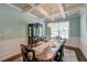Formal dining room with coffered ceilings, a large window, and elegant table setting at 149 Daniels Ridge Dr, Summerville, SC 29485