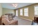 Upstairs bonus room with lots of natural light and comfy couch at 149 Daniels Ridge Dr, Summerville, SC 29485