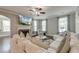 Cozy living room with a fireplace, comfortable seating, and ample natural light at 149 Daniels Ridge Dr, Summerville, SC 29485