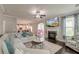 Relaxing living room with a fireplace, comfortable sofa, and ample natural light at 149 Daniels Ridge Dr, Summerville, SC 29485