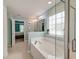 Bright bathroom featuring a soaking tub and glass enclosed shower, perfect for relaxing at 149 Daniels Ridge Dr, Summerville, SC 29485