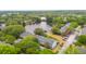Aerial view of a community of townhomes nestled amongst the trees and pond at 153 Heritage Cir # K3, Mount Pleasant, SC 29464
