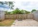 Landscaped backyard featuring a wooden fence, stone pavers, and colorful potted plants at 153 Heritage Cir # K3, Mount Pleasant, SC 29464