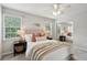Neutral primary bedroom with a plush bed, lamps, side tables, and a ceiling fan at 153 Heritage Cir # K3, Mount Pleasant, SC 29464