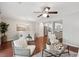 Open concept living area with hardwood flooring, chandelier, and view of the kitchen at 153 Heritage Cir # K3, Mount Pleasant, SC 29464