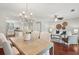 Open-concept living area with dining area, living room, and a view into the modern kitchen at 153 Heritage Cir # K3, Mount Pleasant, SC 29464