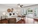 Bright living room with hardwood floors, neutral decor, and sliding glass doors to the sunroom at 153 Heritage Cir # K3, Mount Pleasant, SC 29464