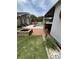 Backyard view includes an in-ground pool, brick patio, fire pit, and an outdoor covered living space at 1606 Waterside Blvd, Moncks Corner, SC 29461