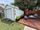 Relaxing backyard deck features an outbuilding, outdoor seating, a grill, and plenty of room for entertaining at 1606 Waterside Blvd, Moncks Corner, SC 29461