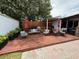 Wonderful backyard deck offers an outdoor kitchen, a dining table, an umbrella, and comfortable seating at 1606 Waterside Blvd, Moncks Corner, SC 29461