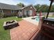 The backyard features a patio with pavers, an outdoor fire pit, and a view of the pool and backyard at 1606 Waterside Blvd, Moncks Corner, SC 29461