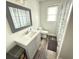Bathroom features a gray vanity, modern fixtures, and stylish shower curtain at 1606 Waterside Blvd, Moncks Corner, SC 29461