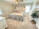 Cozy bedroom featuring neutral walls, carpeted floors, and a comfortable-looking bed with a decorative headboard at 1606 Waterside Blvd, Moncks Corner, SC 29461