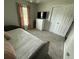 Inviting bedroom with plush carpet, natural light, and a TV for entertainment at 1606 Waterside Blvd, Moncks Corner, SC 29461