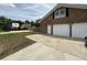 Brick home featuring attached garage, carport, and long driveway at 1606 Waterside Blvd, Moncks Corner, SC 29461