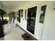 Inviting porch with rocking chairs, stylish front door, and charming decor details at 1606 Waterside Blvd, Moncks Corner, SC 29461